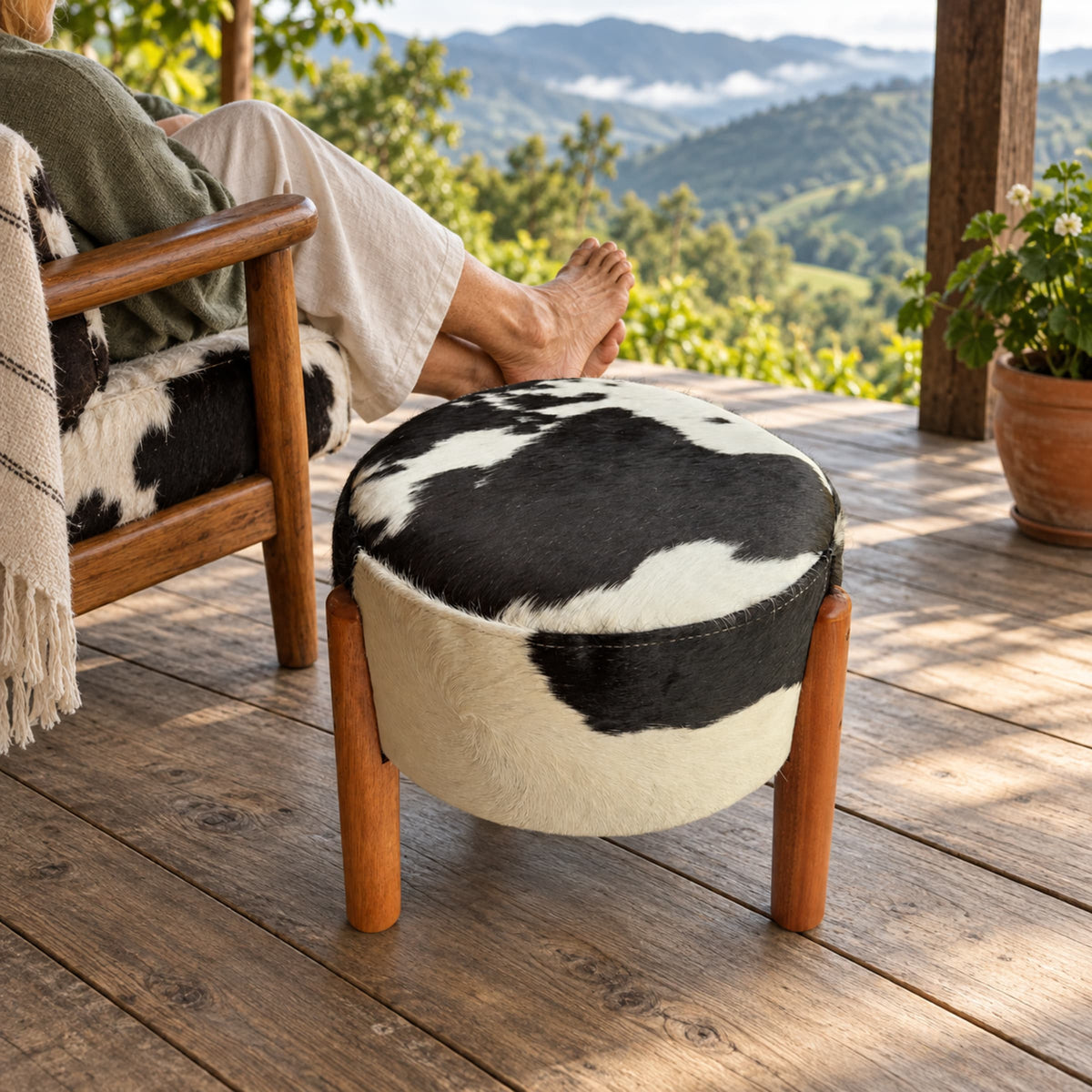 Cowhide Footstool | Black & White Hair-On – Brazilian Hide, Eucalyptus Legs styled in a contemporary home setting