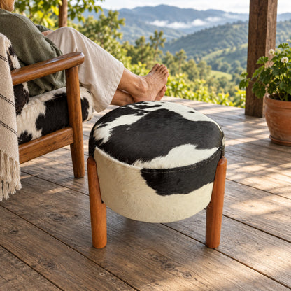 Cowhide Footstool | Black & White Hair-On – Brazilian Hide, Eucalyptus Legs styled in a contemporary home setting